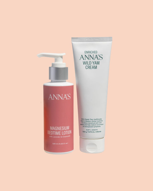 One bottle of Anna's Magnesium Bedtime Lotion and a tube of Enriched Anna's Wild Yam Cream on a peach background.